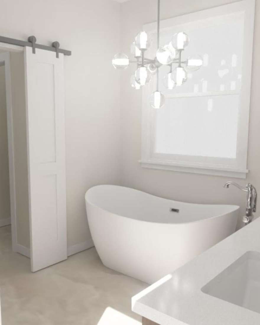A completed Reshape bathroom renovation featuring a freestanding soaking tub beneath a bright window, a glass-globe chandelier, a white shaker barn door, and a quartz-topped vanity.