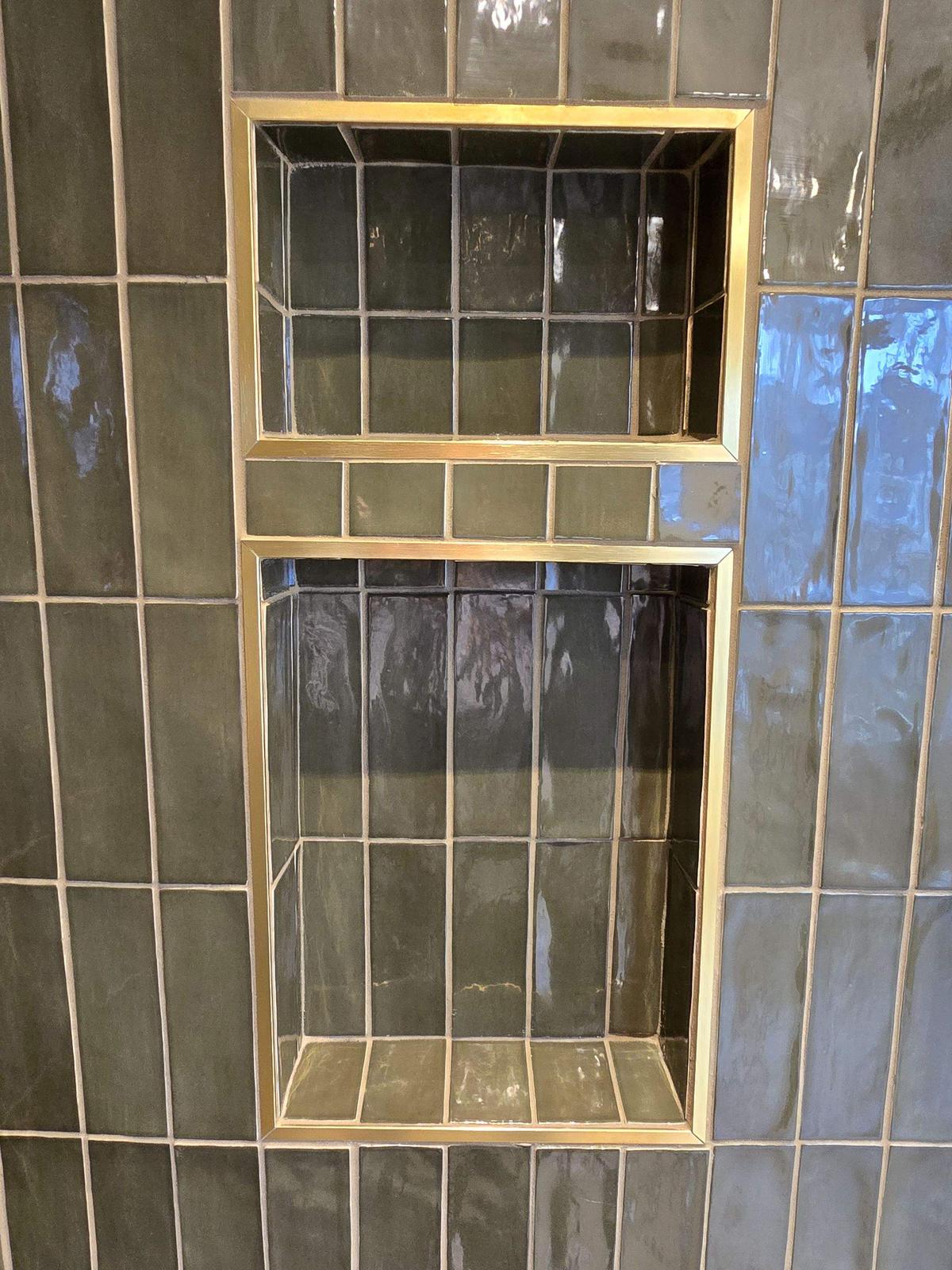 Newtown Road — brass-trimmed shower niche detail.
